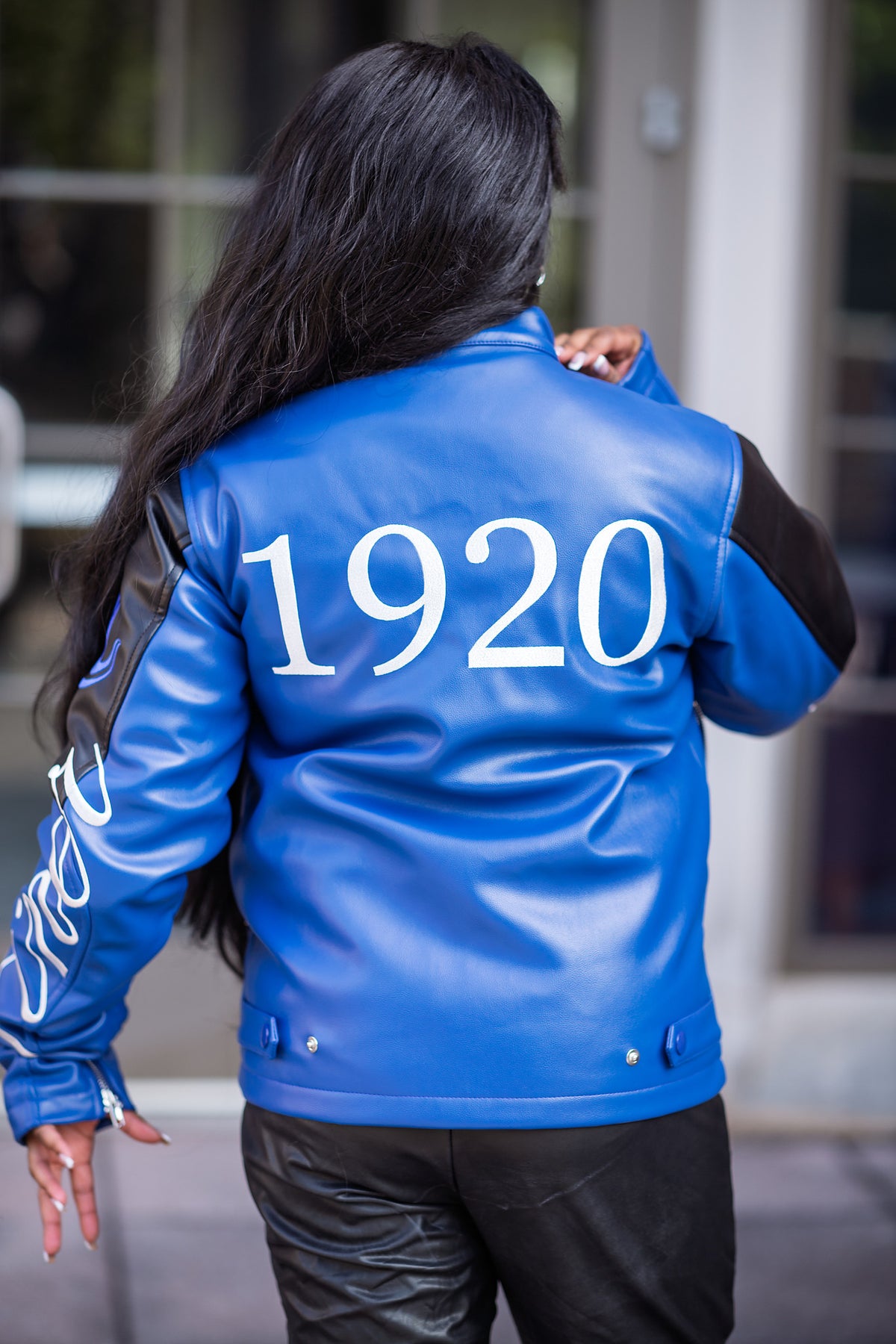 Zeta Phi Beta leather jacket back view outdoors showing the 1920 print