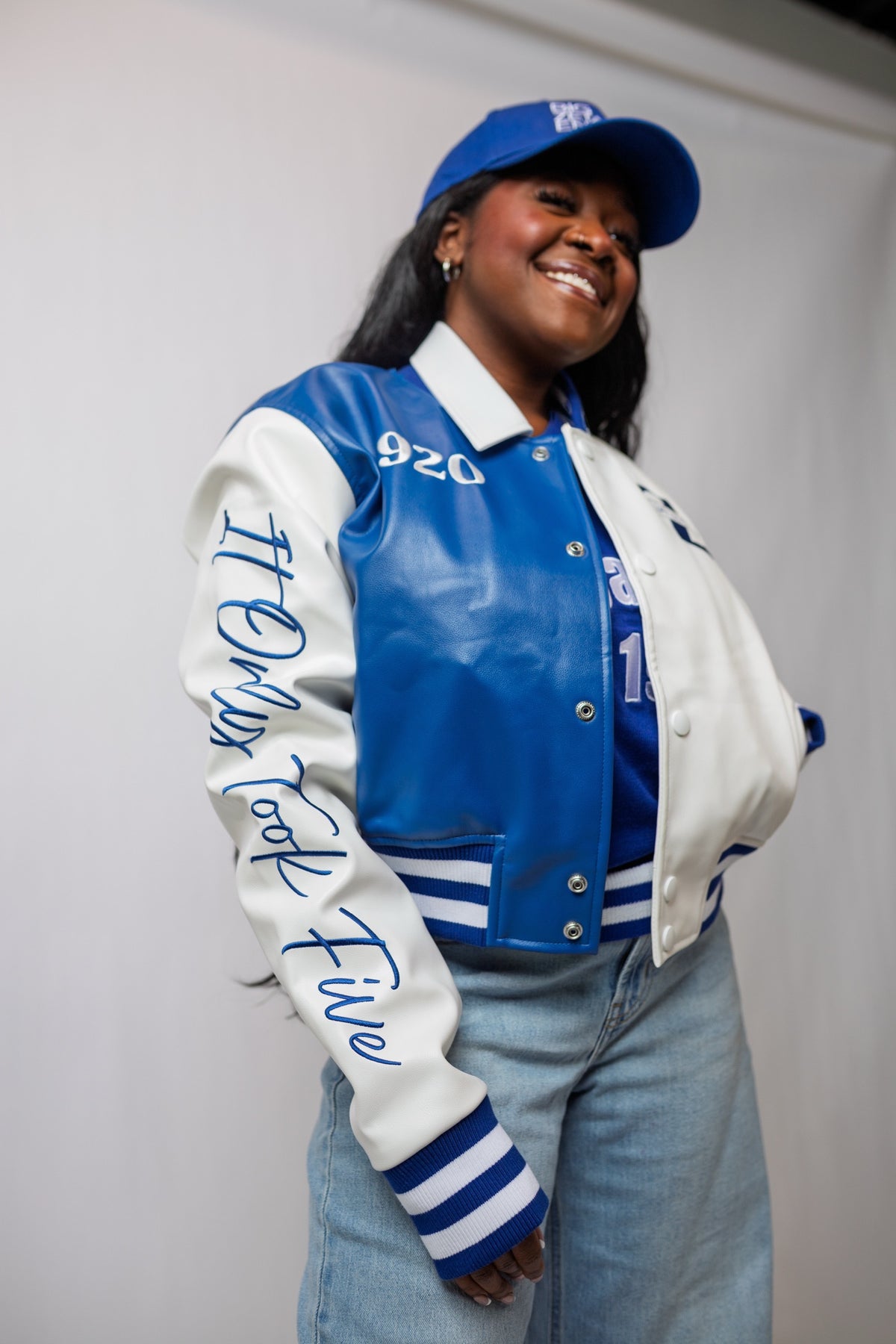 Model turned to show It Only Took Five in Royal Blue script down the white sleeve