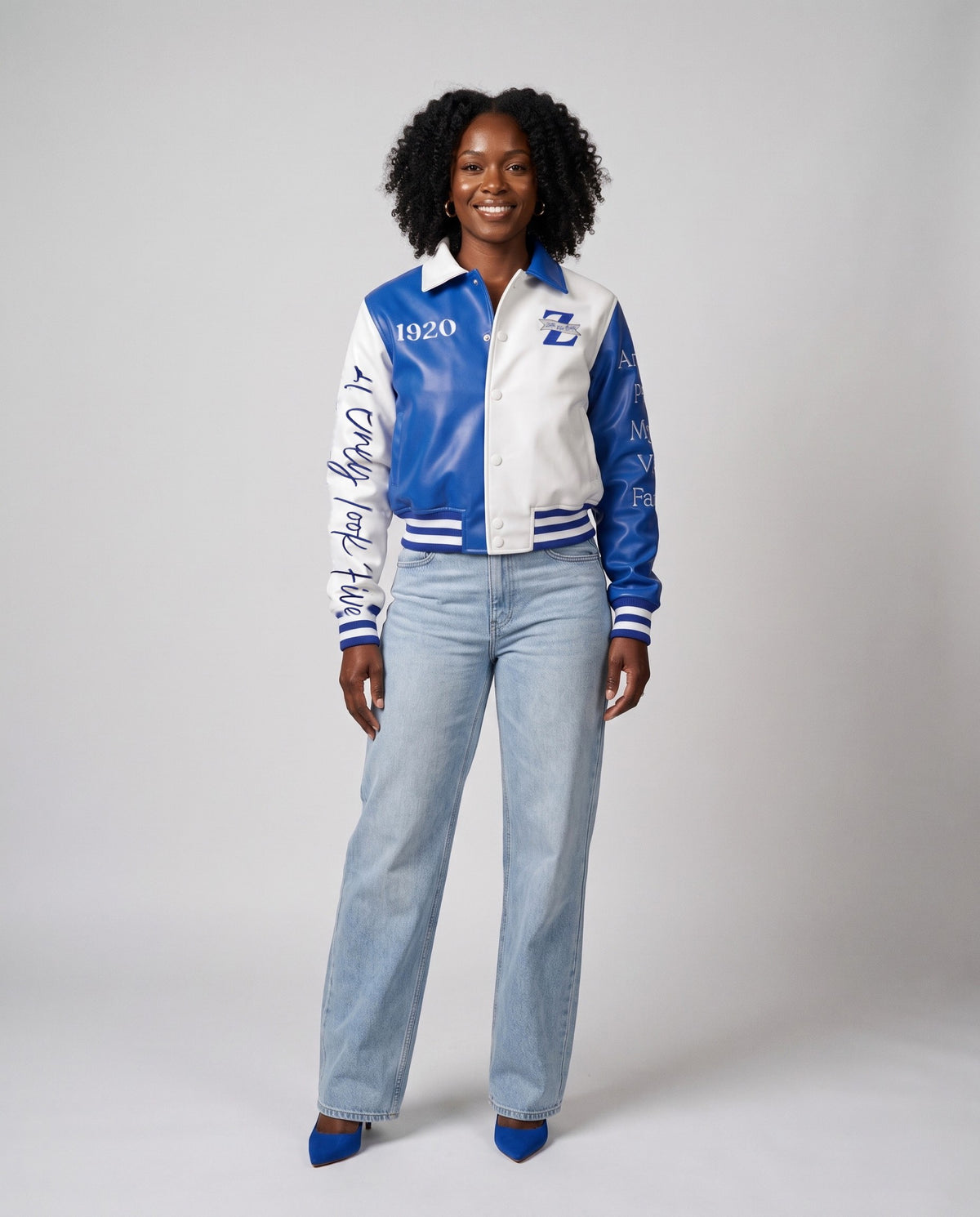 Model in the jacket, front, full length: founders' names down the Royal Blue sleeve