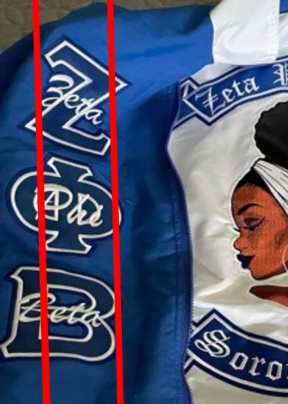 Blue and white jacket with Zeta Phi Beta sorority logo and design.