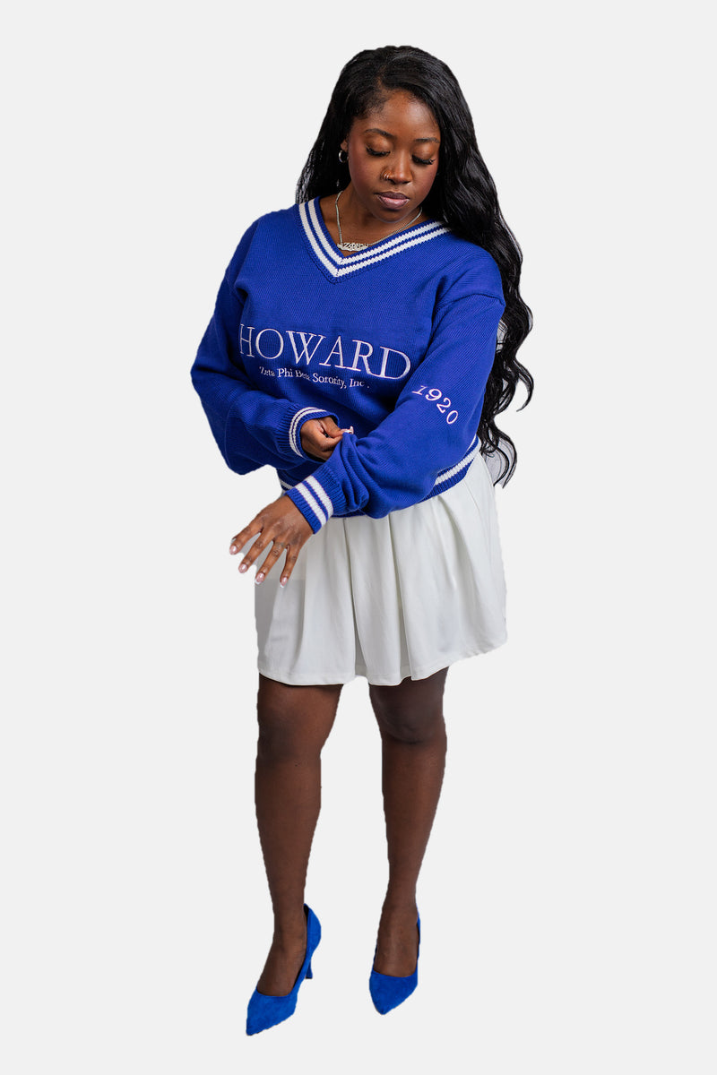 The Howard in Blue Zeta Phi Beta sweater worn with a white skirt