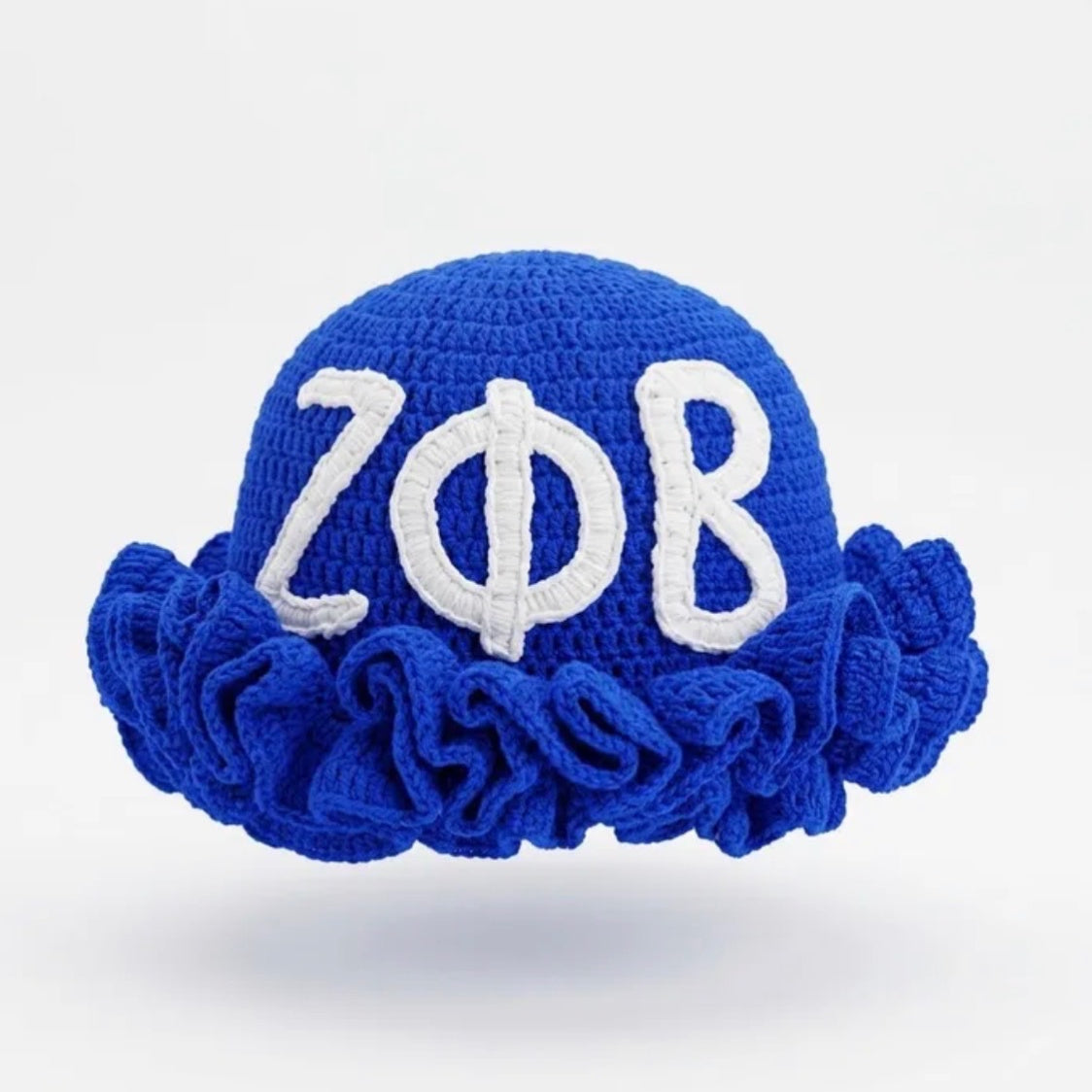 Zeta Phi Beta crochet hat in royal blue with white ZΦB letters and a ruffled brim, front view
